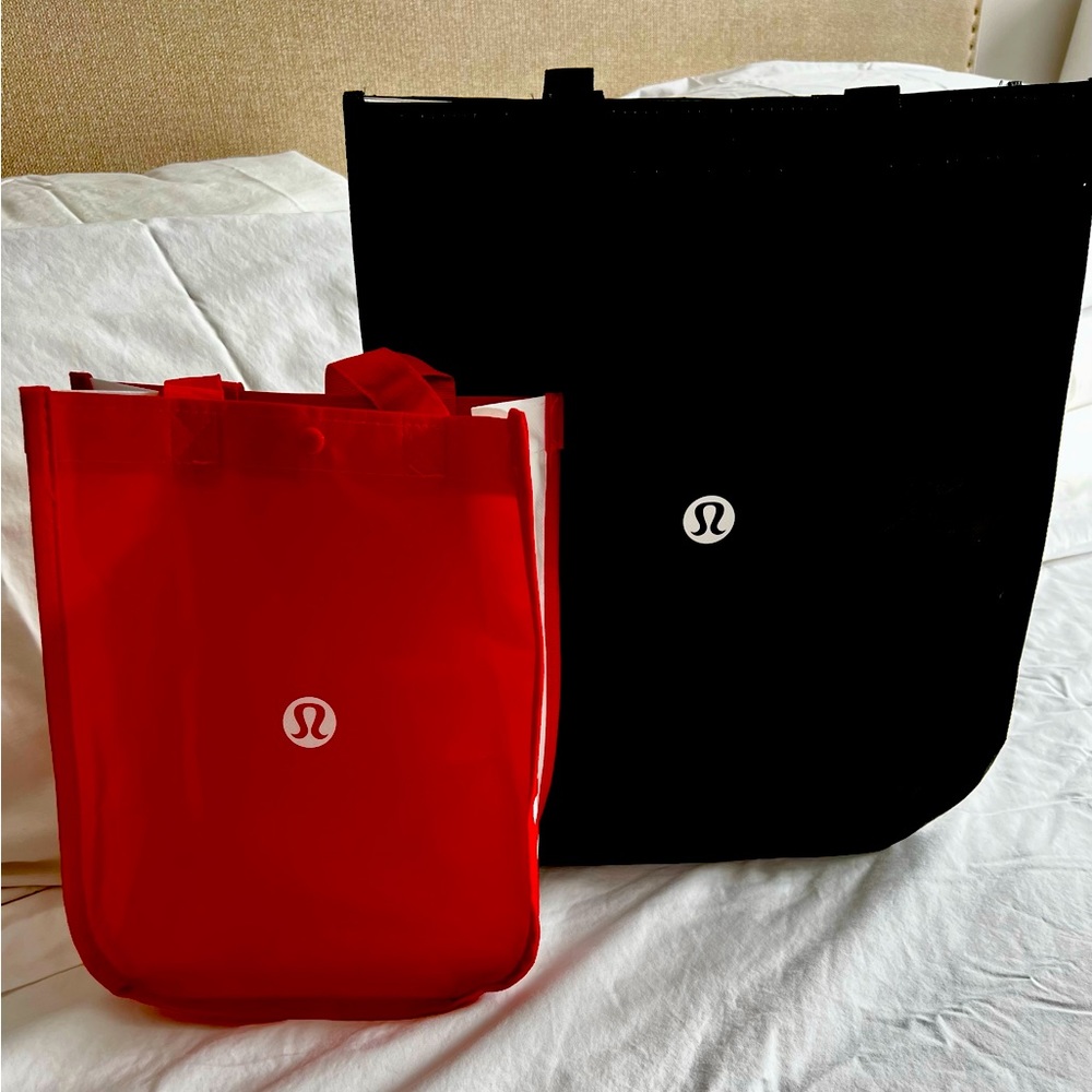 Official Lululemon shopping bags. Large black, small red. Sold together.